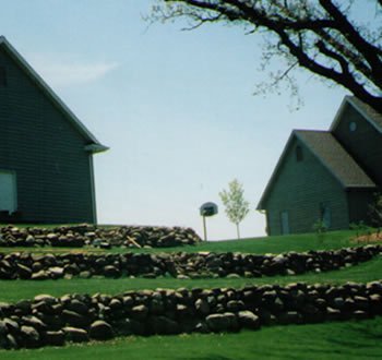 Retaining walls can improve the value and use of steeply sloped properties that would otherwise be unusable.